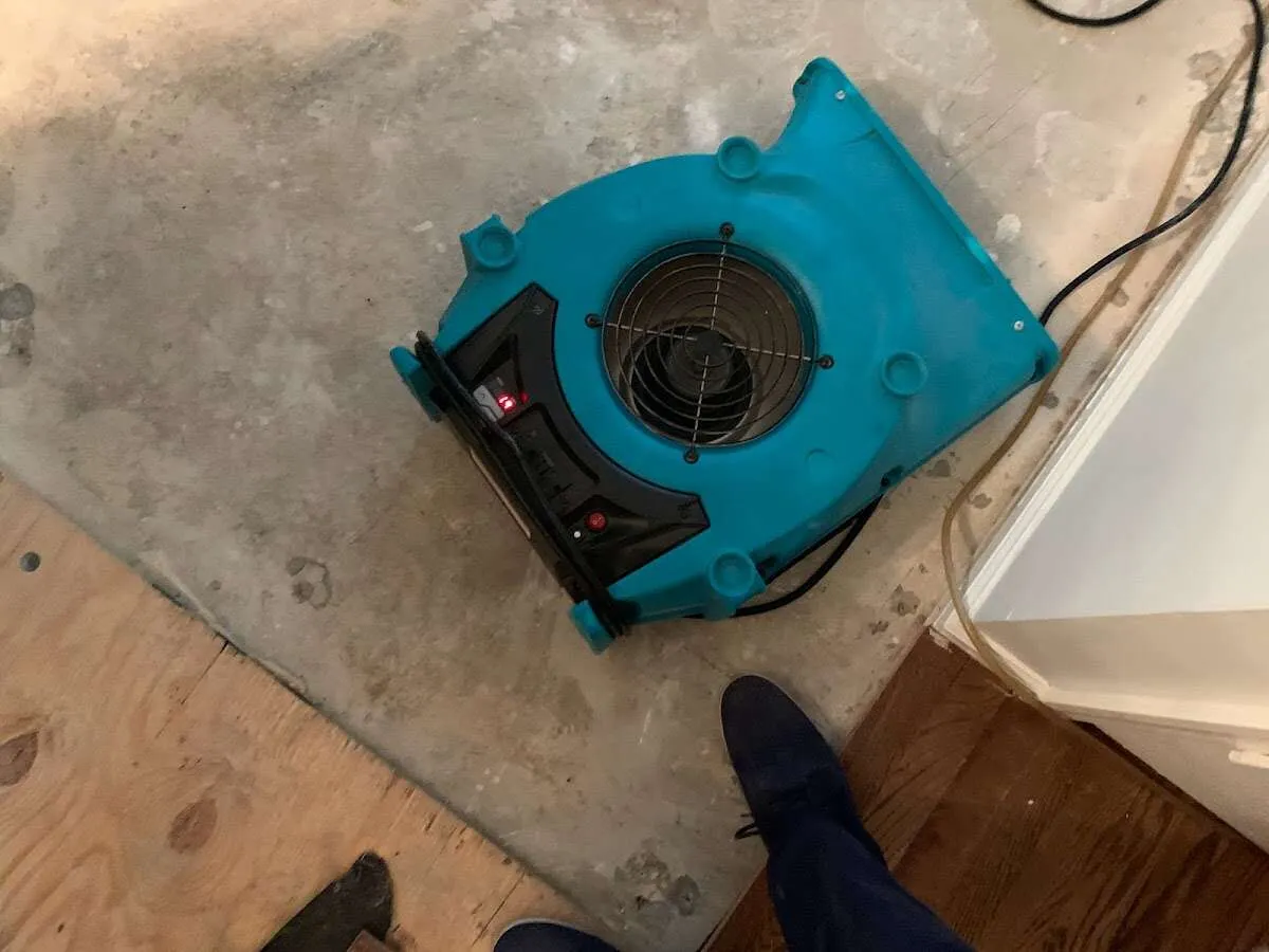 Air mover drying subfloor during Commercial Water Damage Restoration in Strongsville